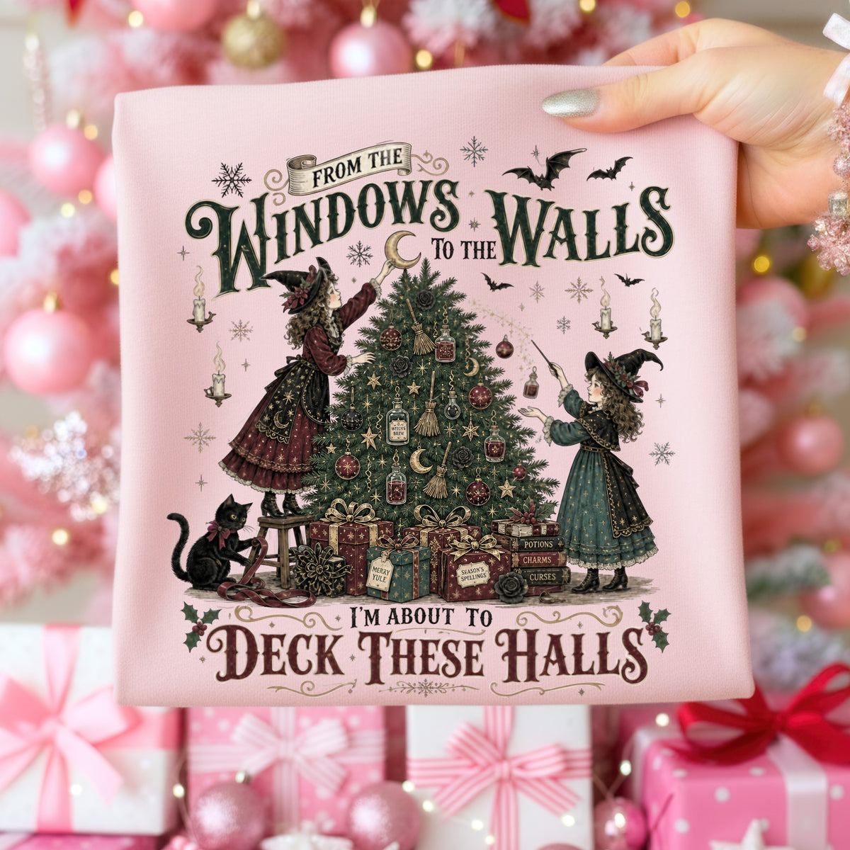 Witches decorating a Christmas tree with potions and spell books, text reads "Deck These Halls".
