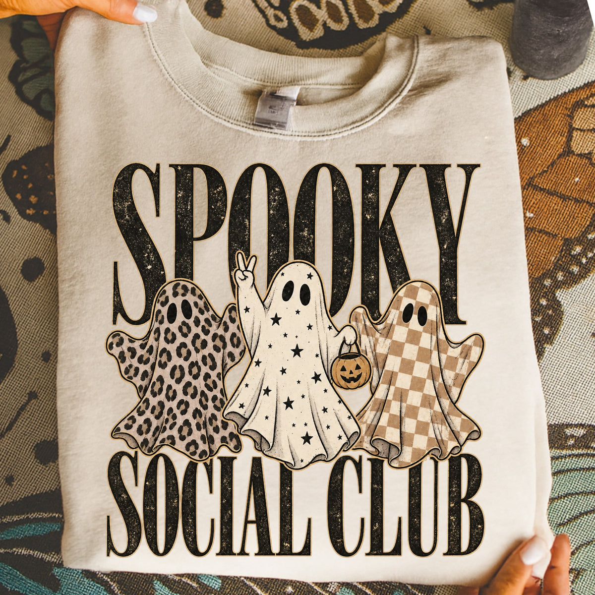Cream sweatshirt with "SPOOKY SOCIAL CLUB" text and three ghosts.