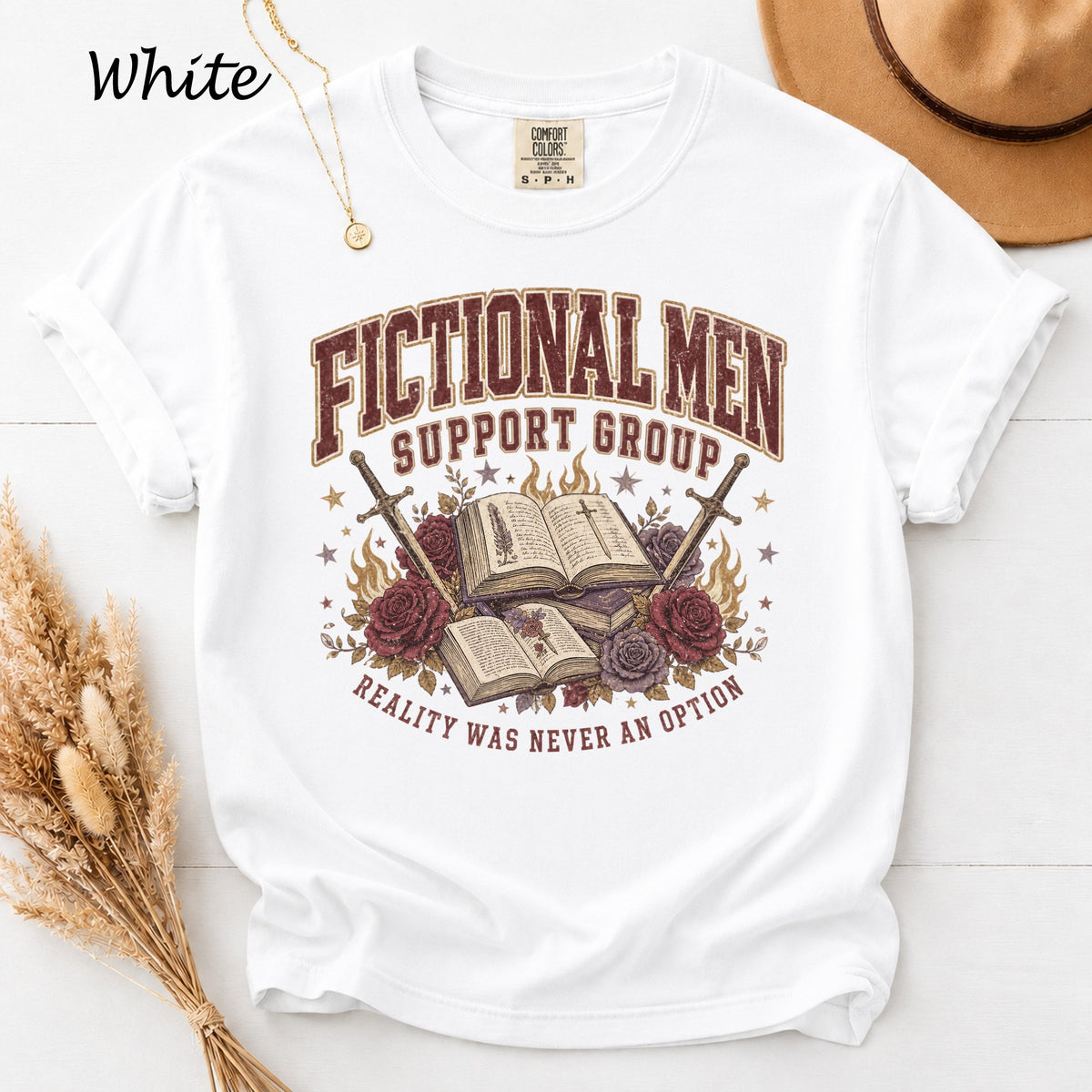 White t-shirt with "Fictional Men Support Group" and swords, books, roses.