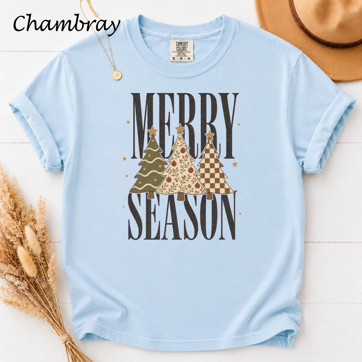 Light blue t-shirt with "Merry Season" text and three Christmas trees.