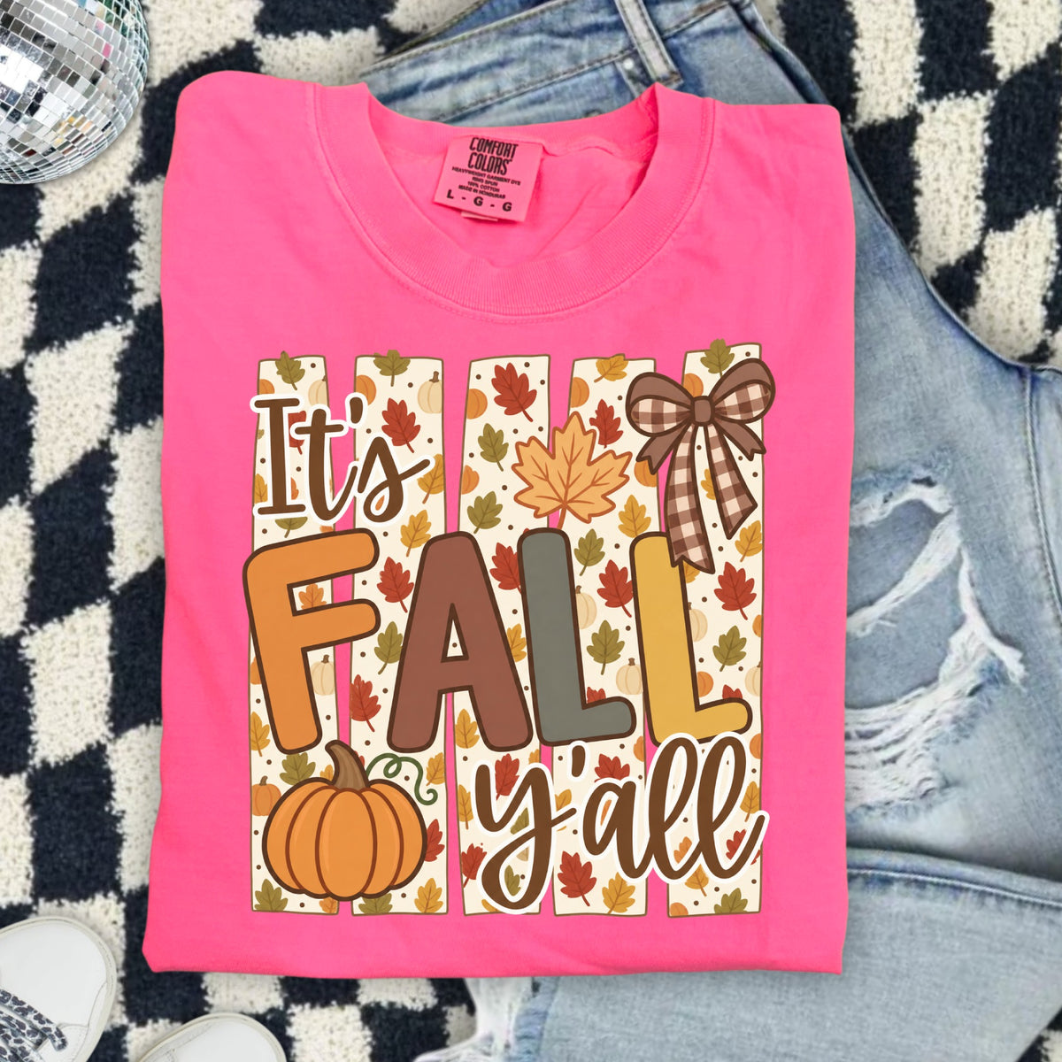 Pink t-shirt with "It's FALL y'all" graphic featuring pumpkins and fall leaves.