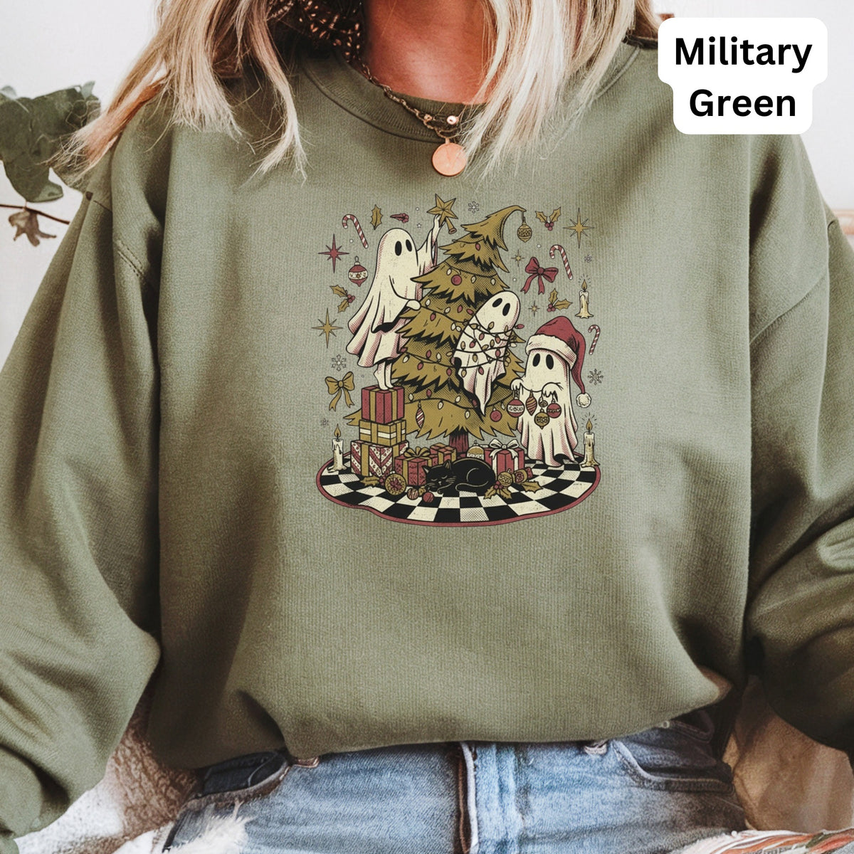 Crewneck sweatshirt with Christmas ghosts decorating a tree, Gifts, black cat, and a checkerboard circle.