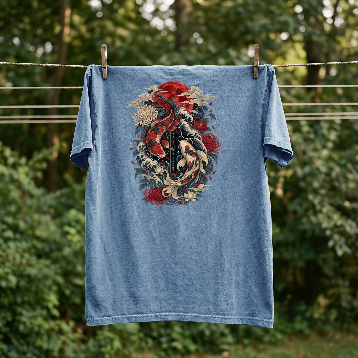 Blue t-shirt with Japanese koi fish, chrysanthemum, and wave graphic with text.