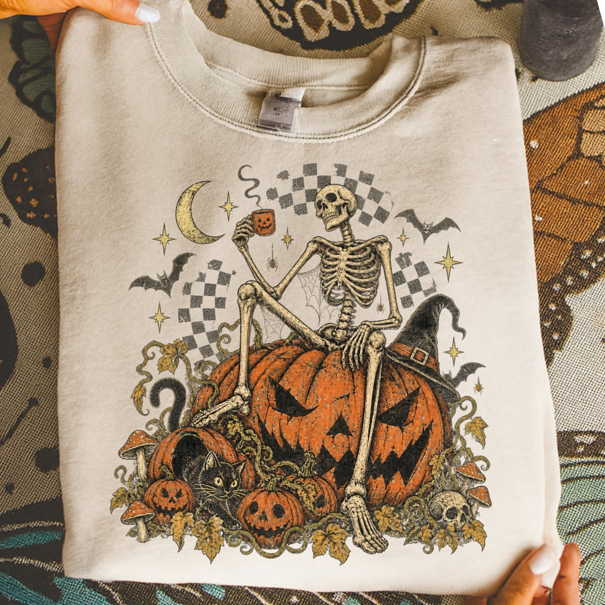 Skeleton holding jack-o'-lantern mug, sitting on pumpkin with black cat and mushrooms.