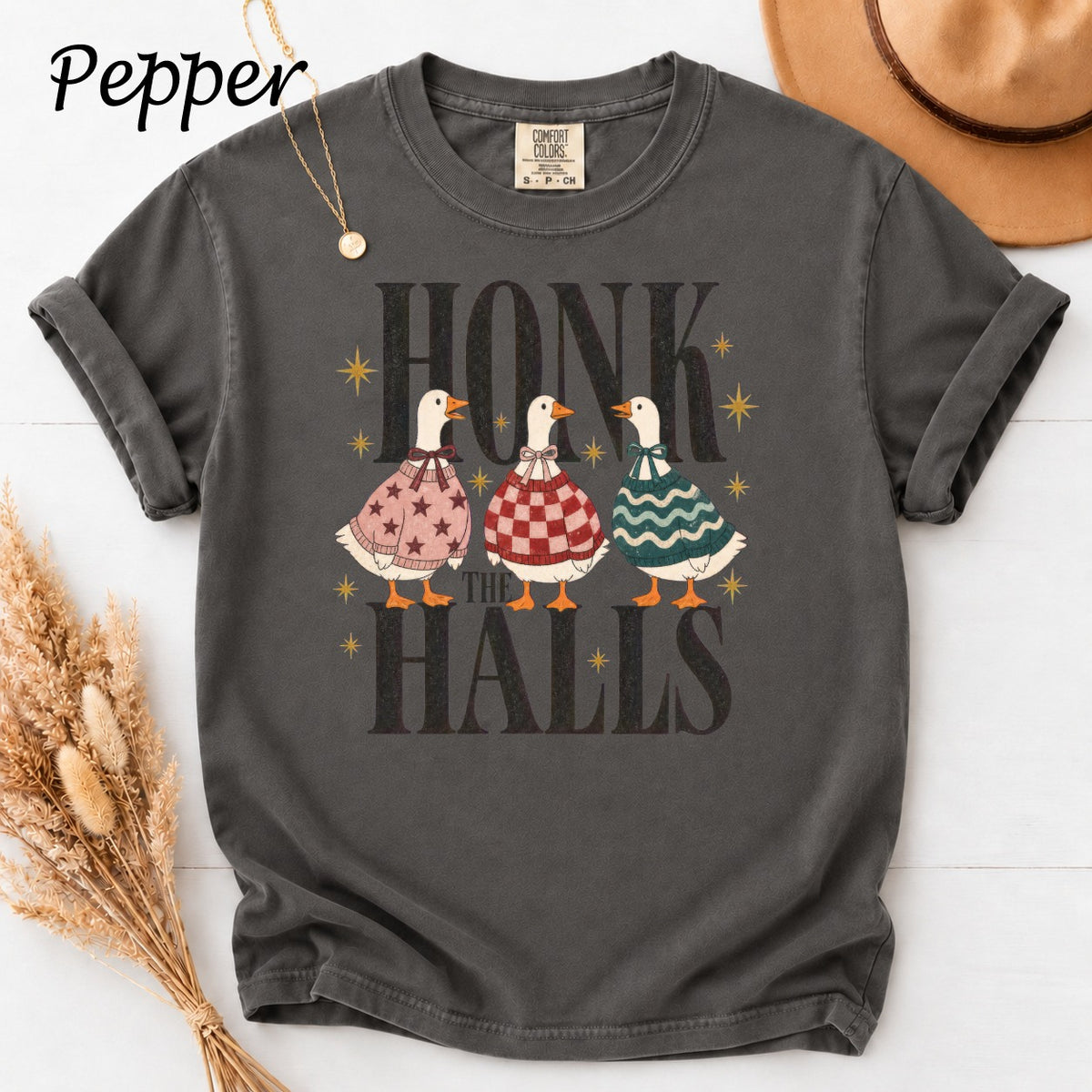 Dark gray t-shirt with graphic of three ducks and text "HONK THE HALLS".