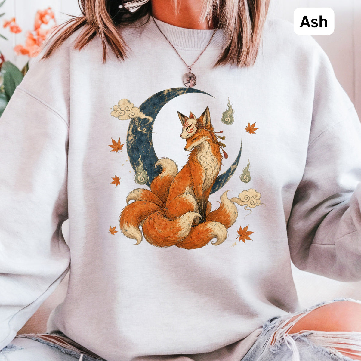 Ash sweatshirt with a nine-tailed fox on a crescent moon.