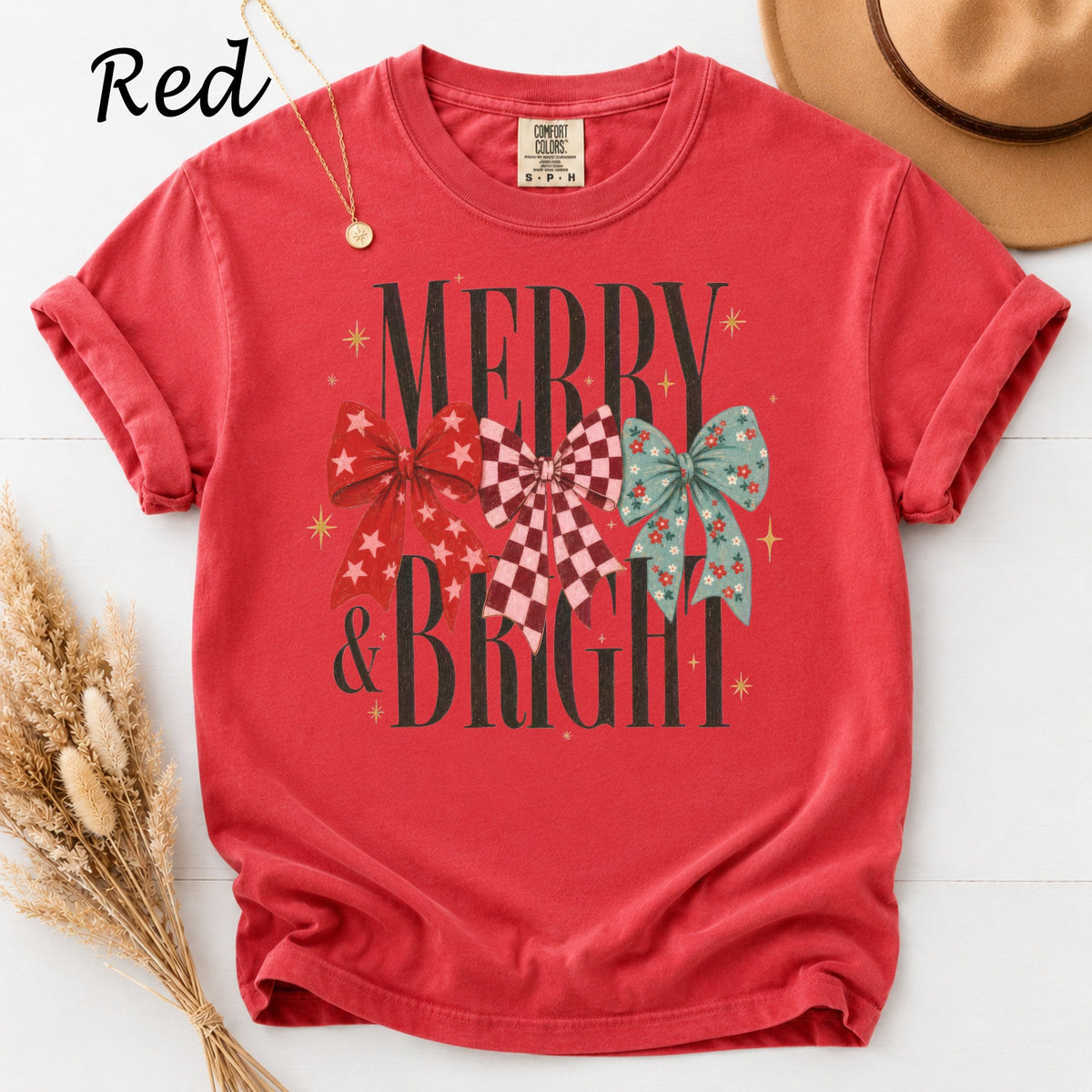 Red t-shirt with "Merry & Bright" text and three patterned bows.