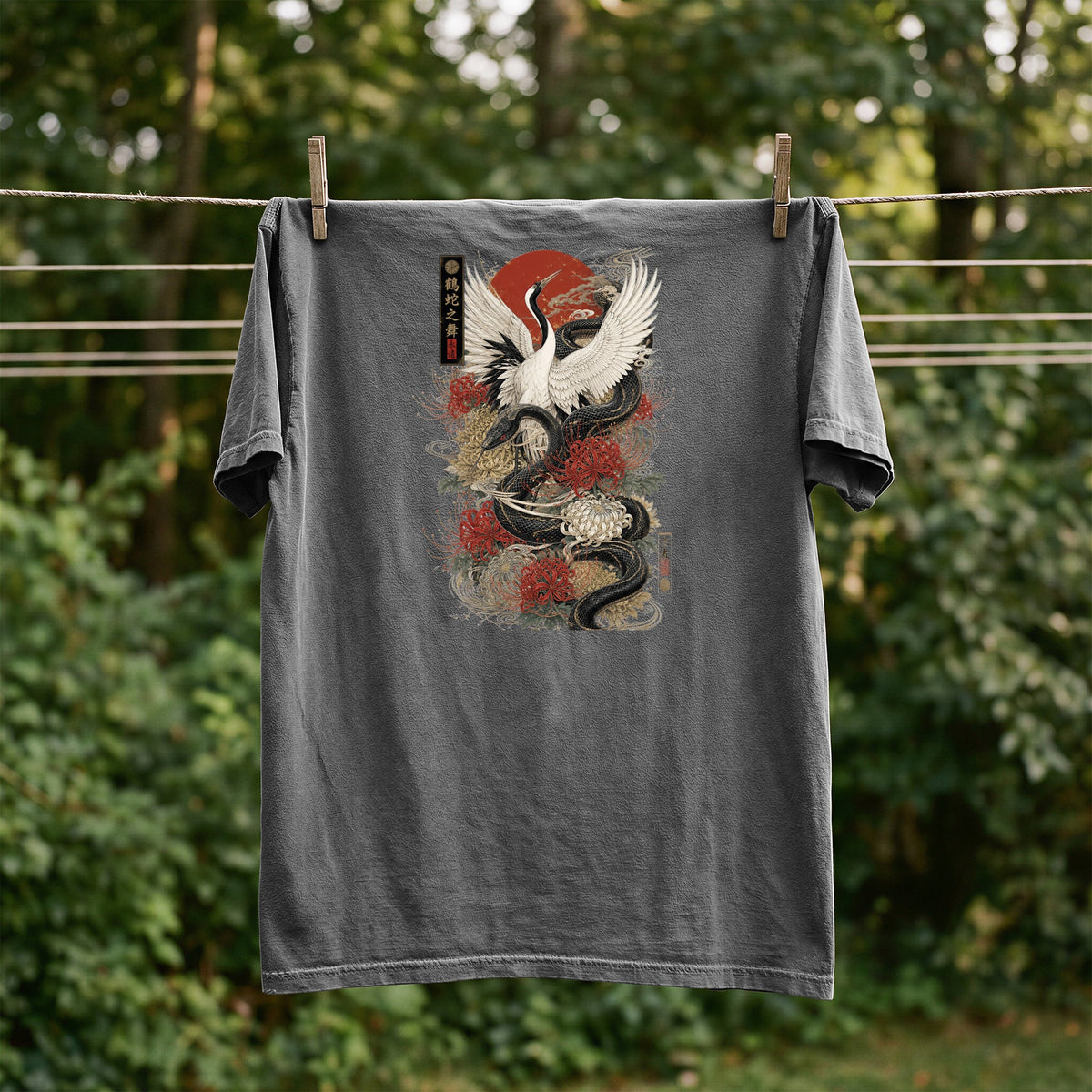 Grey t-shirt with Japanese crane, snake, and floral design, and text.