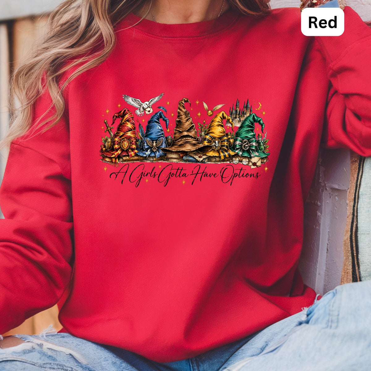 Red sweatshirt with wizard hats and "A Girls Gotta Have Options" text.