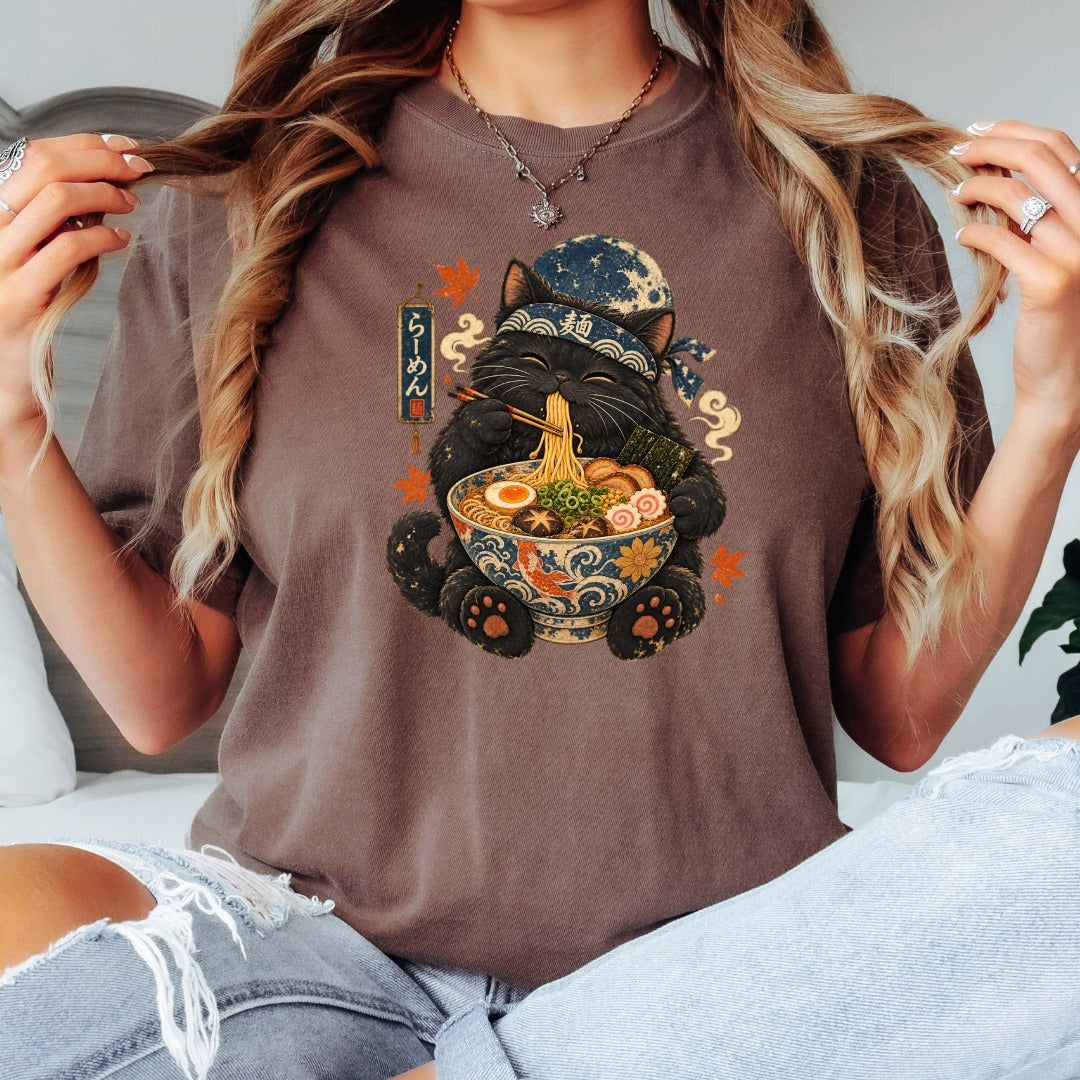 Black cat in bandana eating ramen from decorative bowl, with Japanese text.