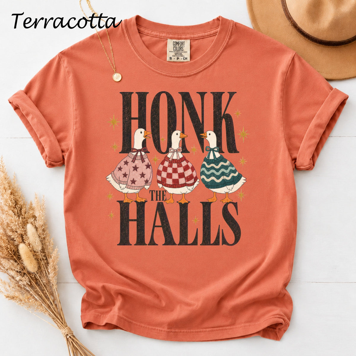 Terracotta t-shirt with three ducks and "Honk the Halls" text.