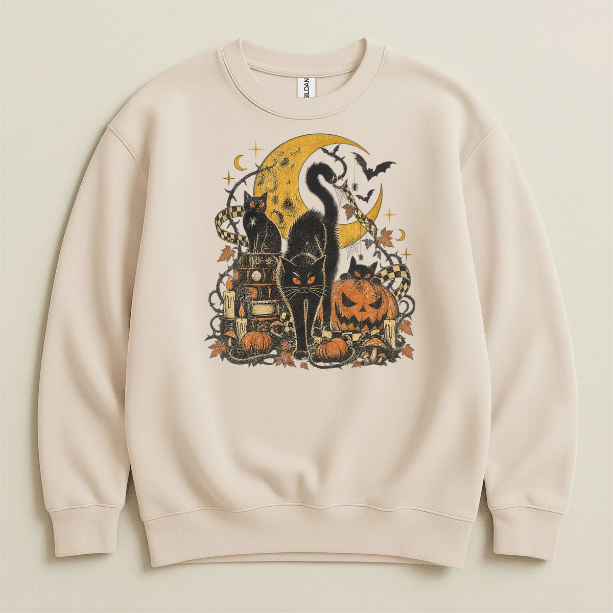 Cream sweatshirt with Halloween graphic of black cats, moon, pumpkins, and bats.
