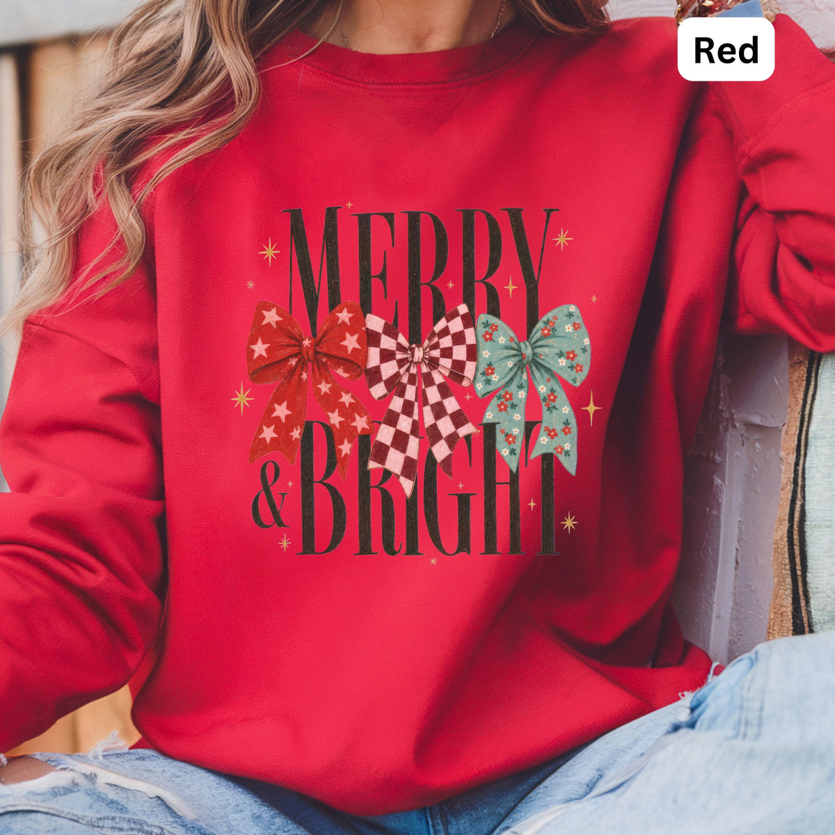 Red sweatshirt with "MERRY & BRIGHT" text and three decorative bows.
