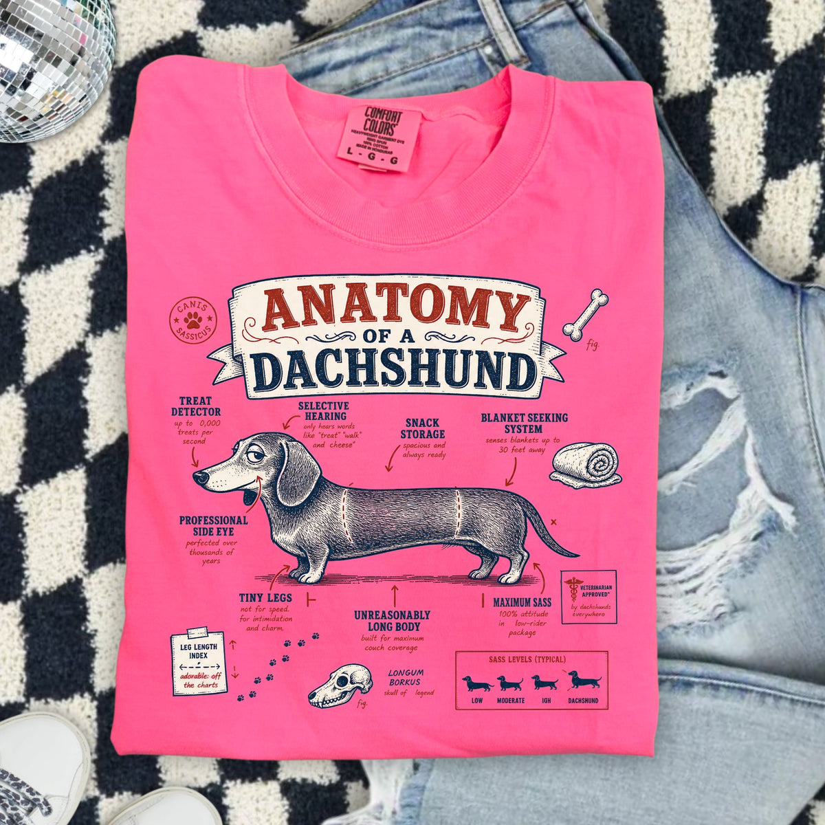 Pink t-shirt with "Anatomy of a Dachshund" graphic and humorous labels.