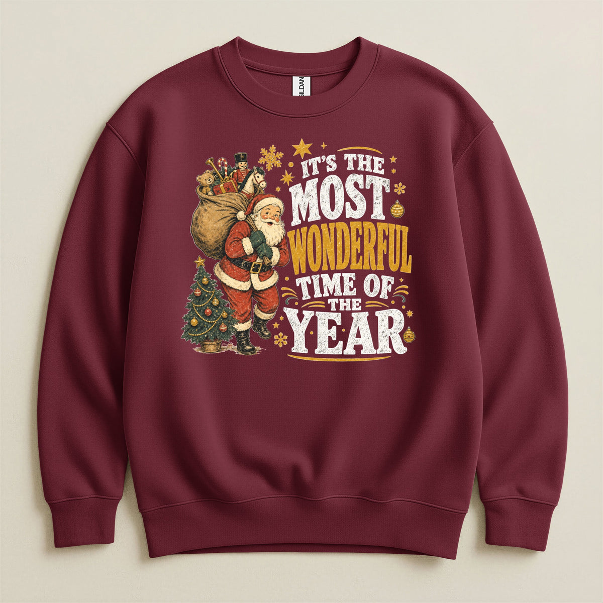 Maroon sweatshirt with Santa and Christmas tree graphic reading "It's the most wonderful time of the year."