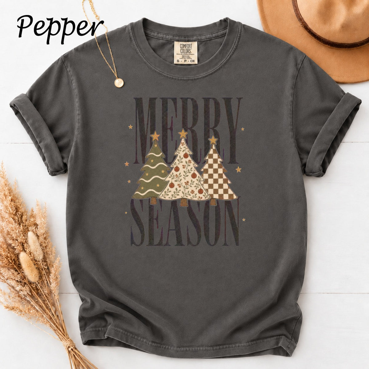 Dark gray t-shirt with "Merry Season" text and three decorated Christmas trees.