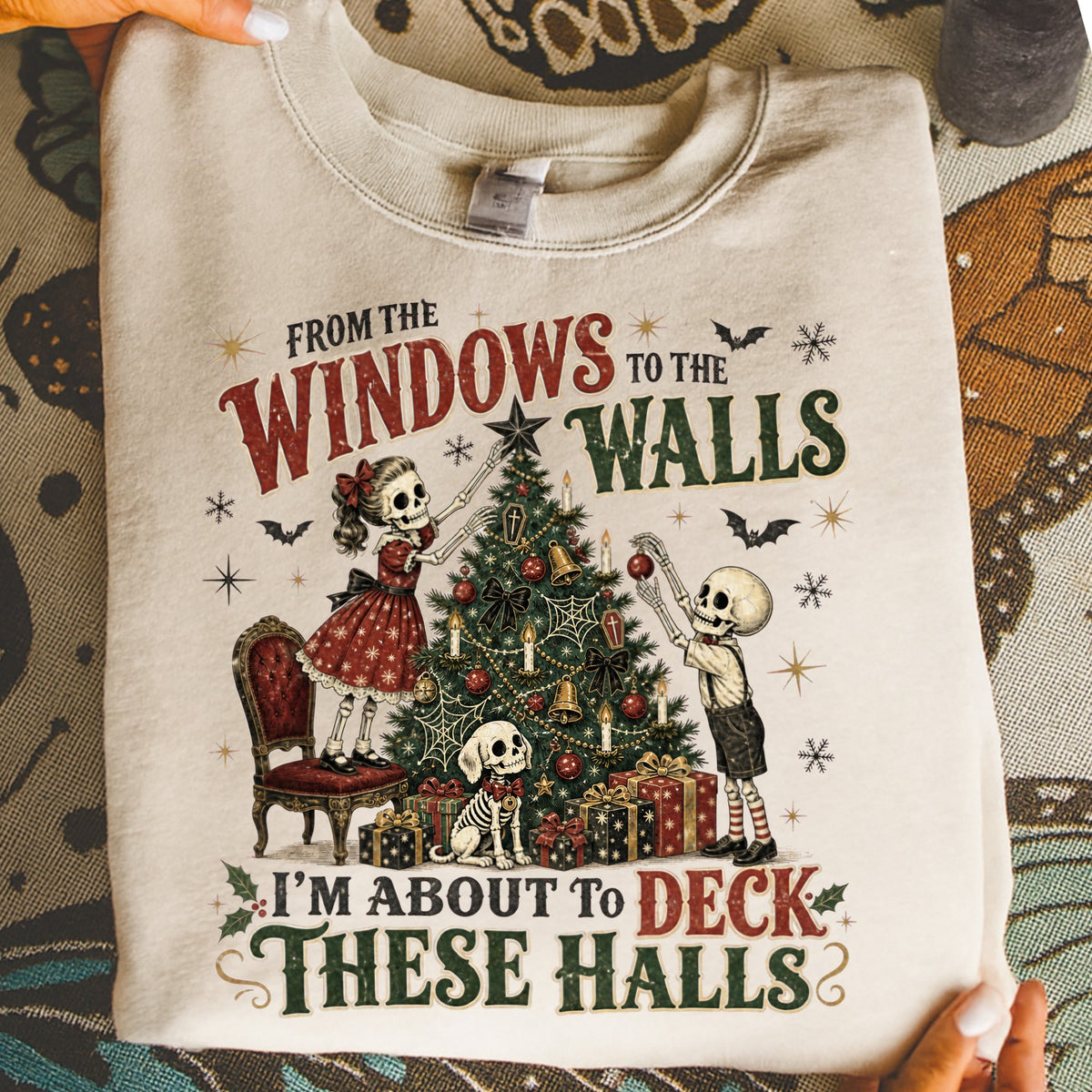 Skeleton couple and dog decorate Christmas tree with text "I'm about to deck these halls".