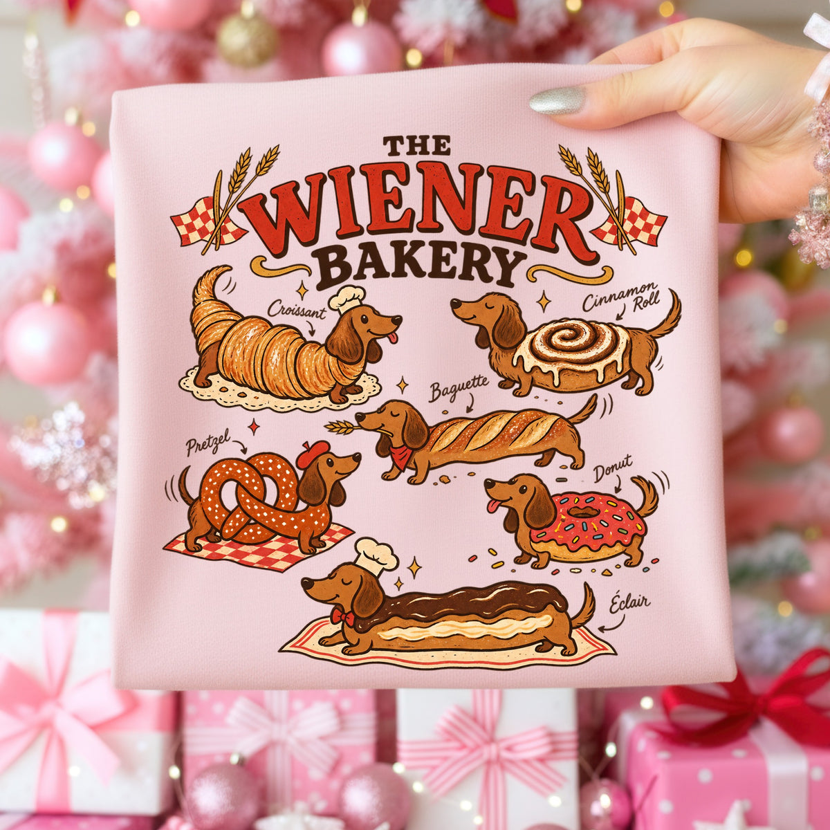 Dachshunds dressed as baked goods with text "The Wiener Bakery."