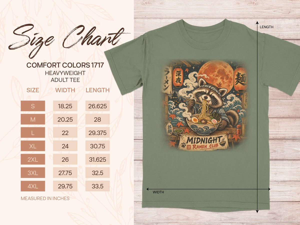 Size chart for a heavyweight adult tee with a raccoon eating ramen graphic.