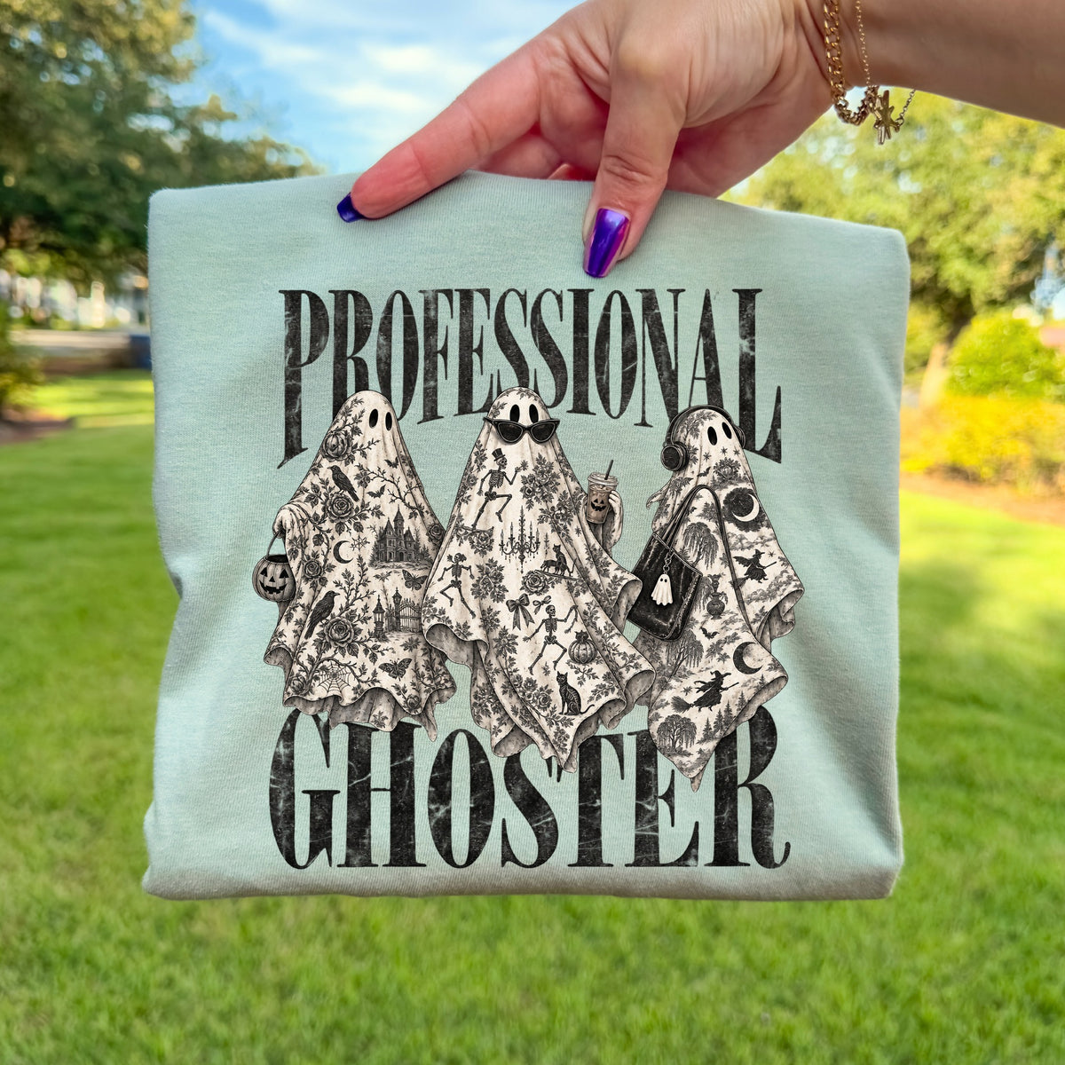 Light blue t-shirt with "PROFESSIONAL GHOSTER" and three patterned ghosts.
