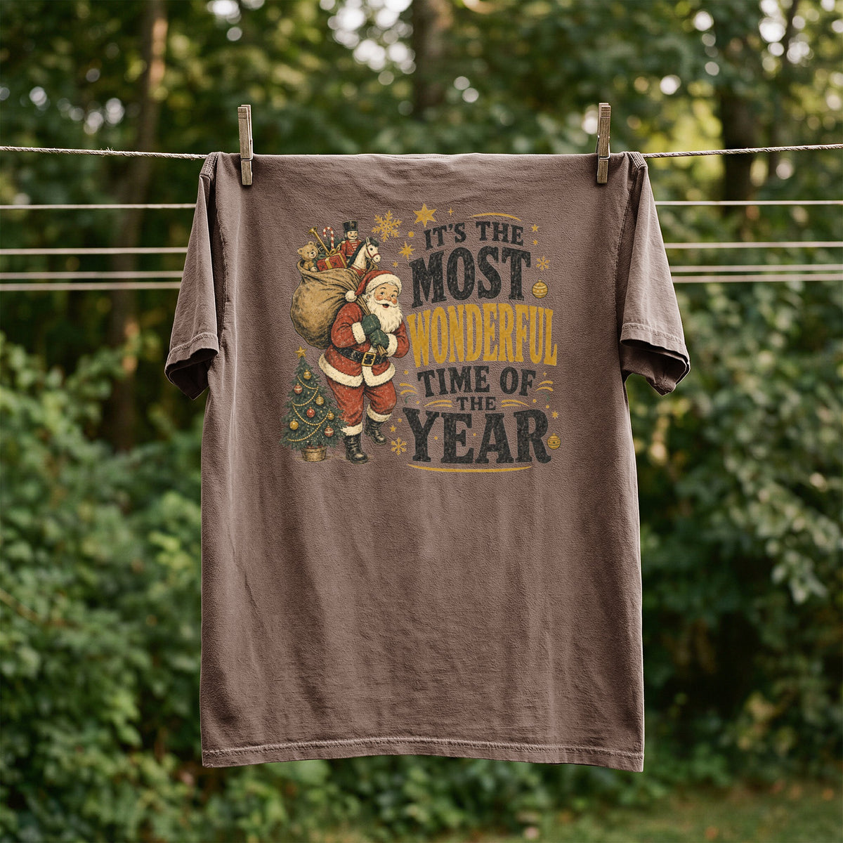 Brown t-shirt with Santa, Christmas tree, and "It's The Most Wonderful Time Of The Year" text.