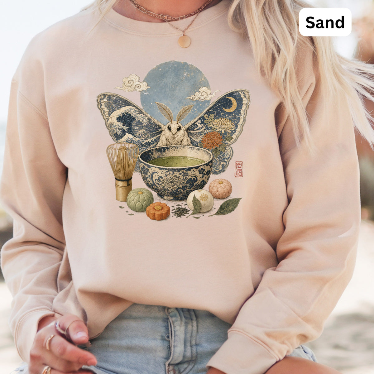 Peach sweatshirt with moth, tea ceremony, and moon print.