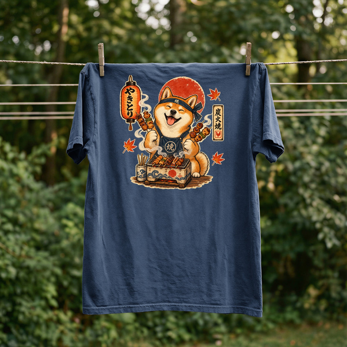 Shiba Inu chef grilling skewers with Japanese text, on a navy t-shirt.