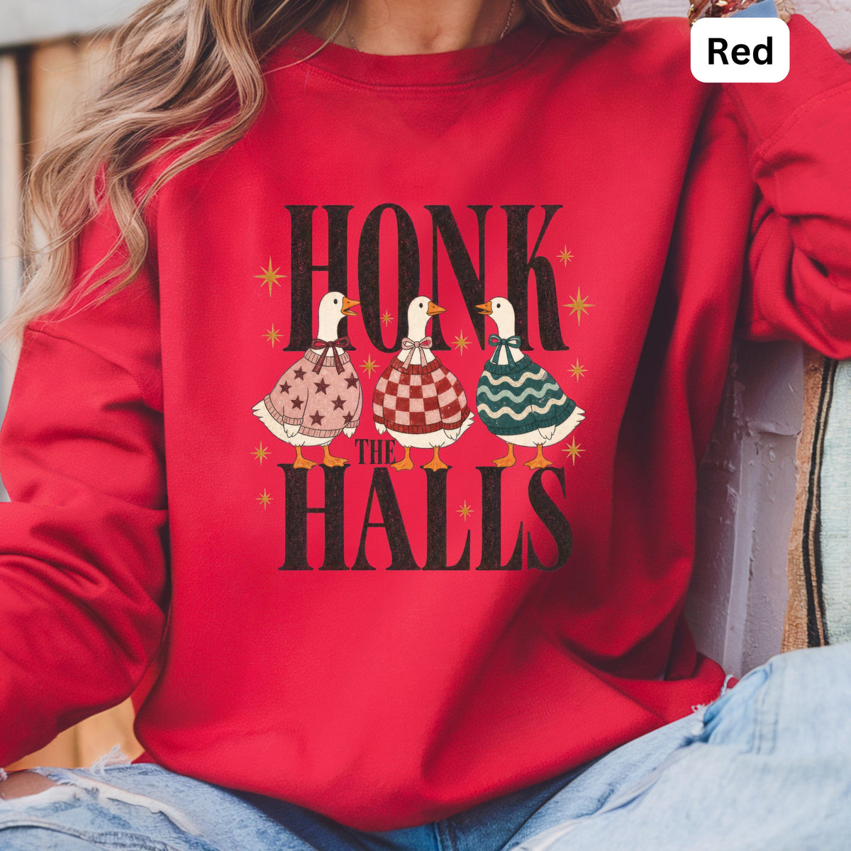 Red sweatshirt with "Honk the Halls" text and three ducks in festive sweaters.
