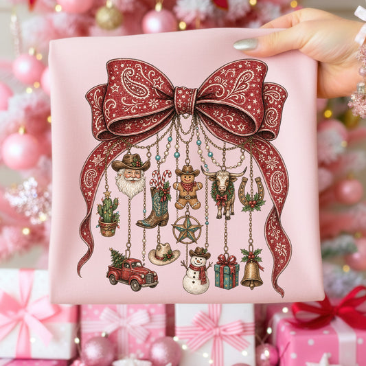 Pink shirt with a festive western-themed Christmas graphic.
