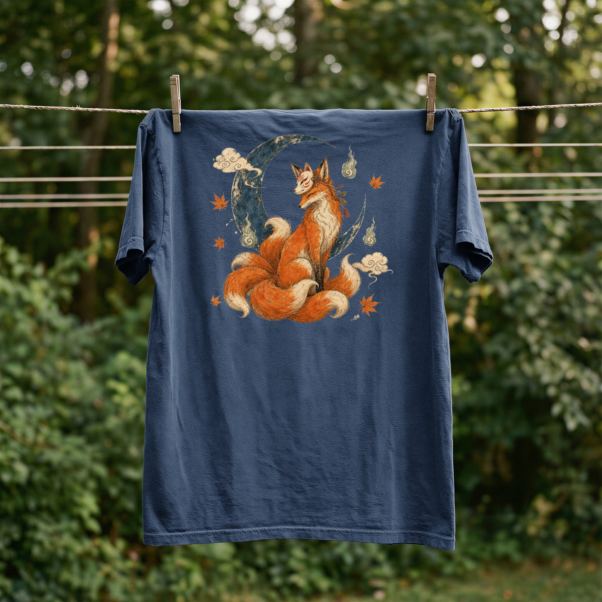 Navy t-shirt with a Kitsune fox illustration on a crescent moon.