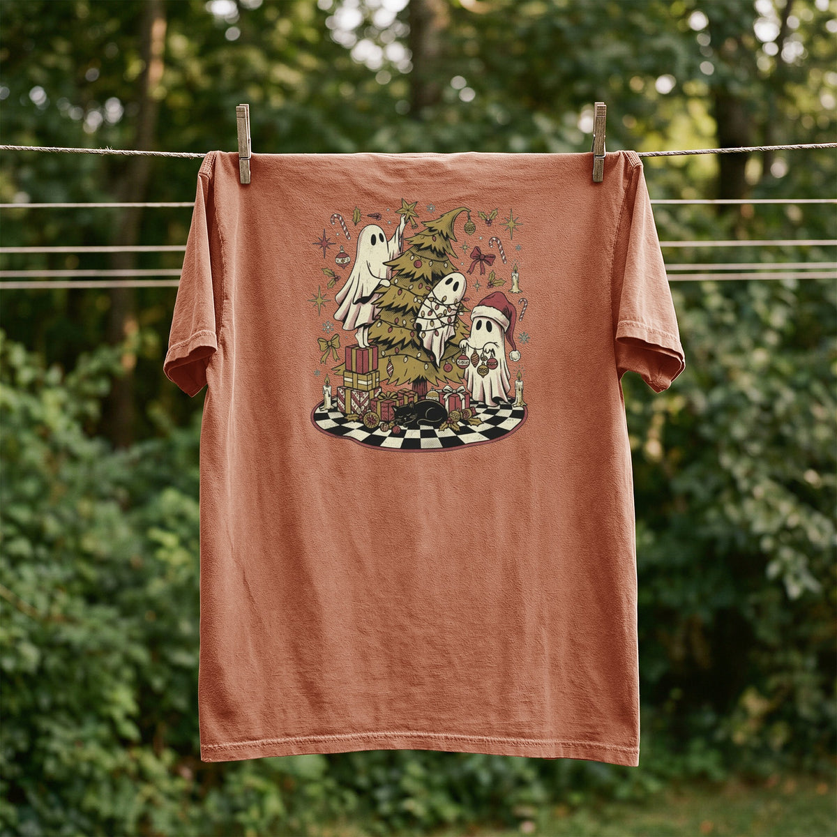 Brown t-shirt with Ghosts decorating a Christmas tree and presents.