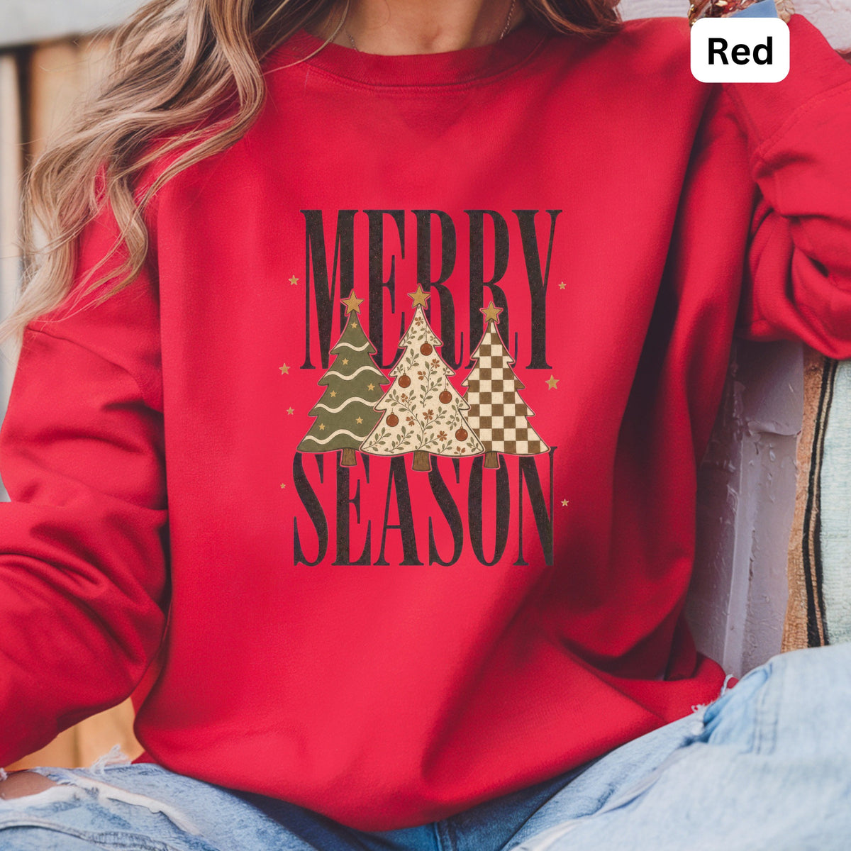 Red crewneck sweatshirt with "MERRY SEASON" and three patterned Christmas trees.