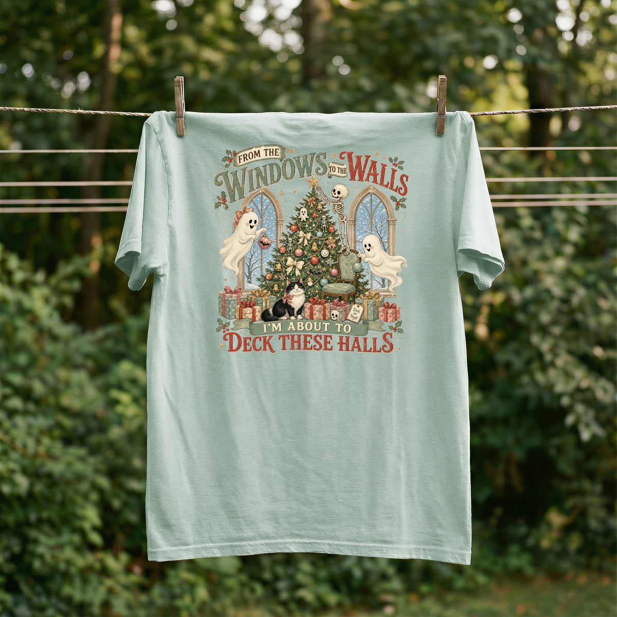 Mint green t-shirt with graphic "From the Windows to the Walls I'm About to Deck These Halls".