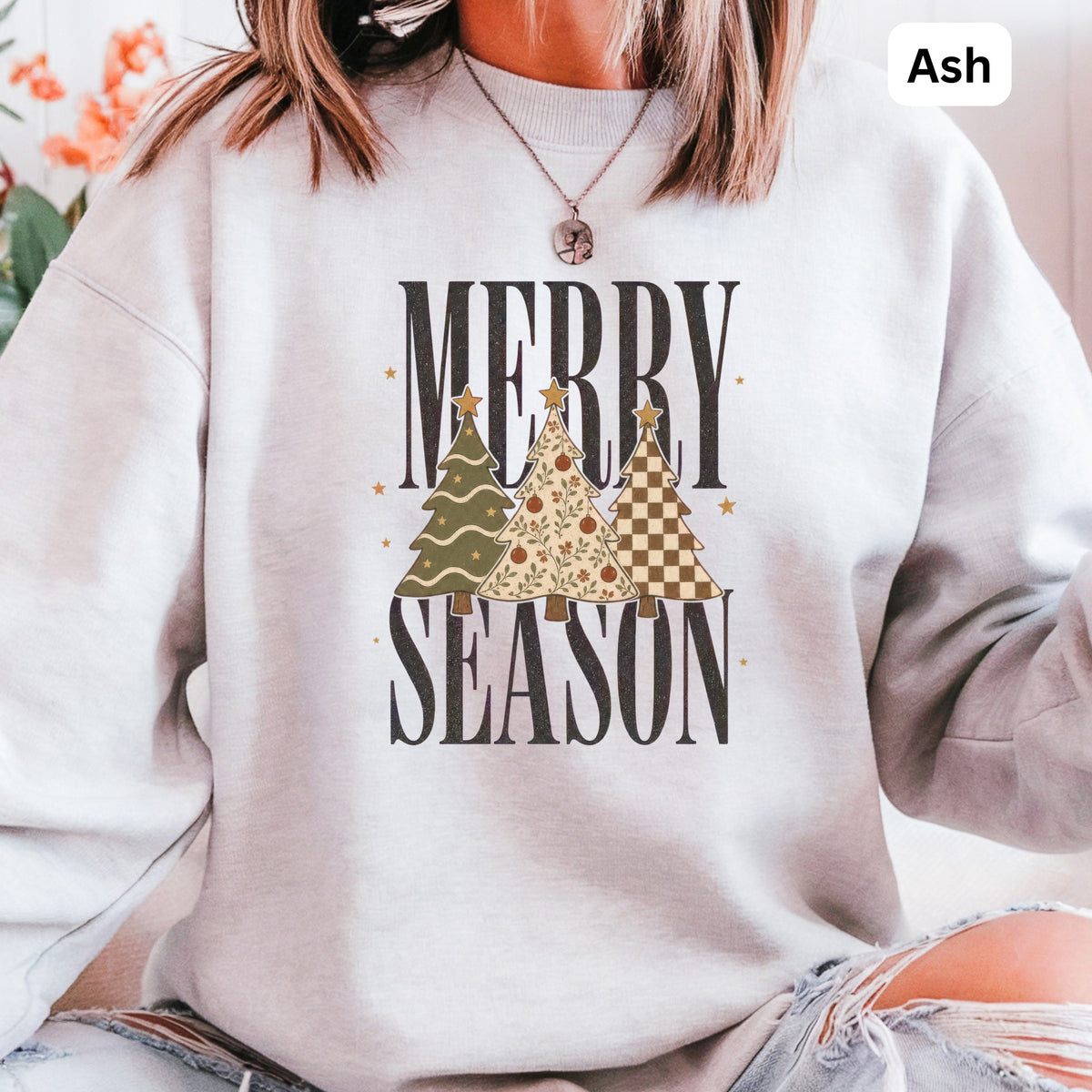 Ash grey sweatshirt with "Merry Season" text and three festive trees.
