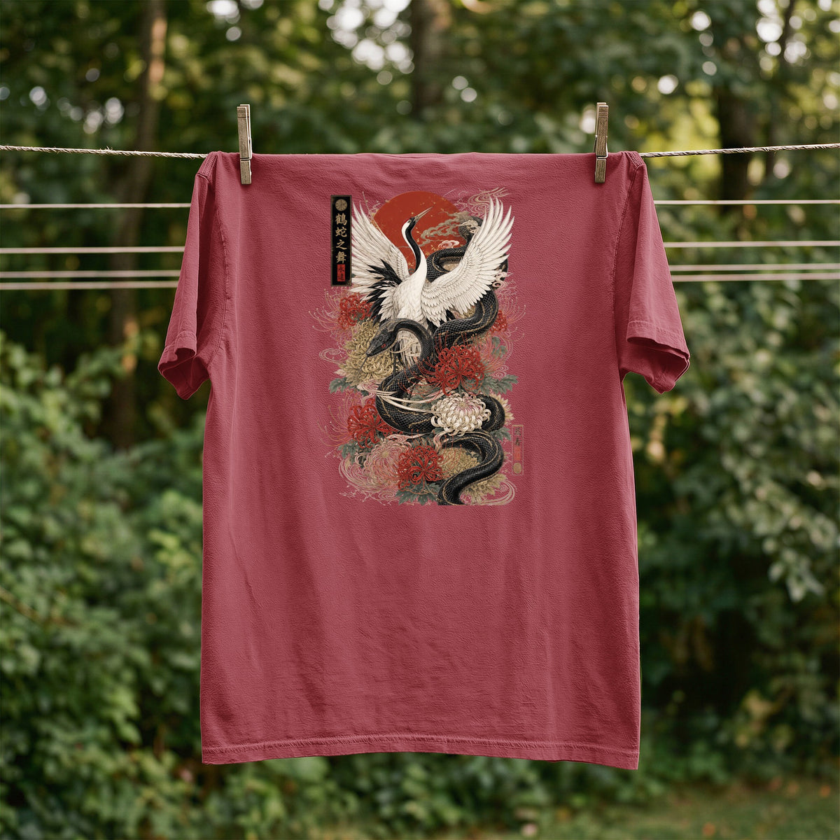 Red t-shirt with a black snake and white crane design with floral accents and Japanese text.
