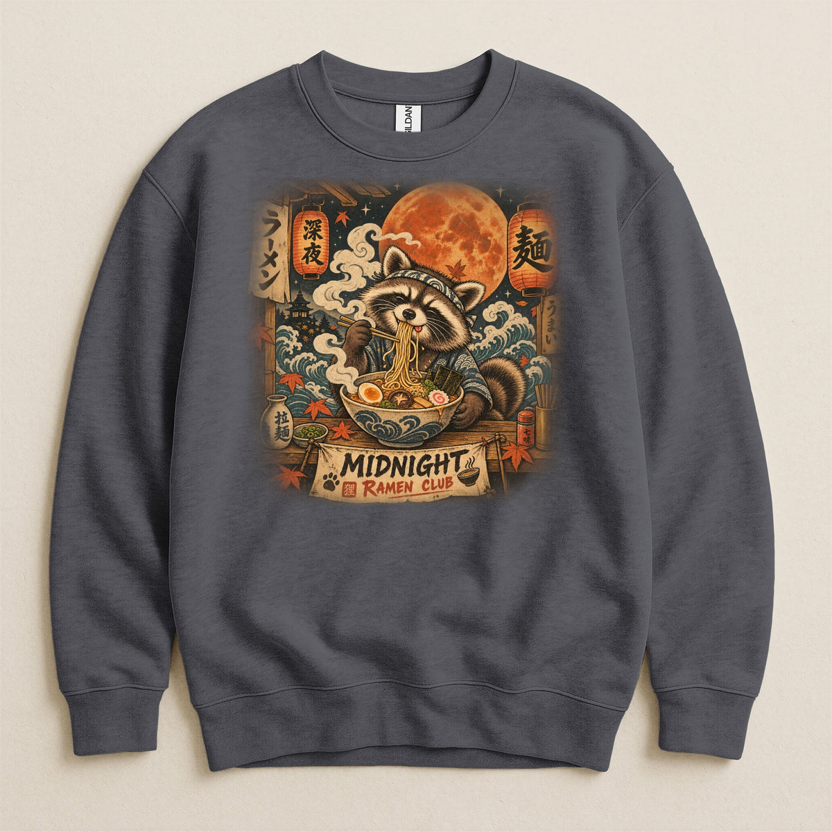 Raccoon eating ramen under a full moon with Japanese lanterns and text.