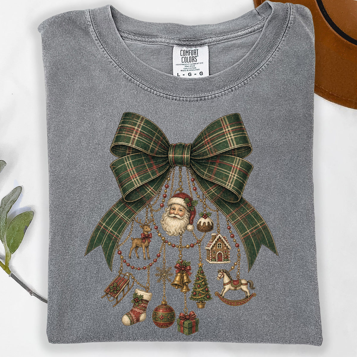 Gray t-shirt with a green plaid bow and vintage Christmas ornaments including Santa.