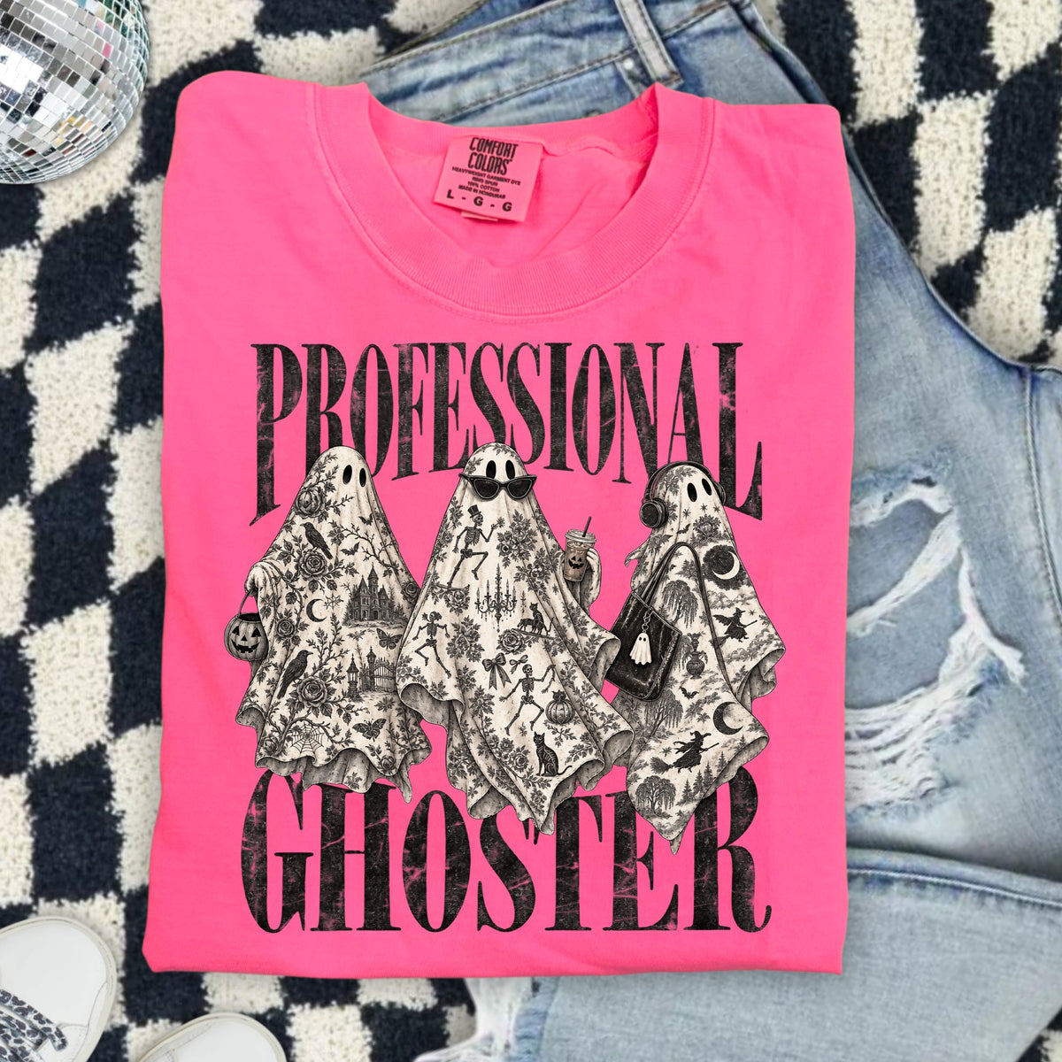 Bright pink t-shirt with three ghosts and the text "PROFESSIONAL GHOSTER".