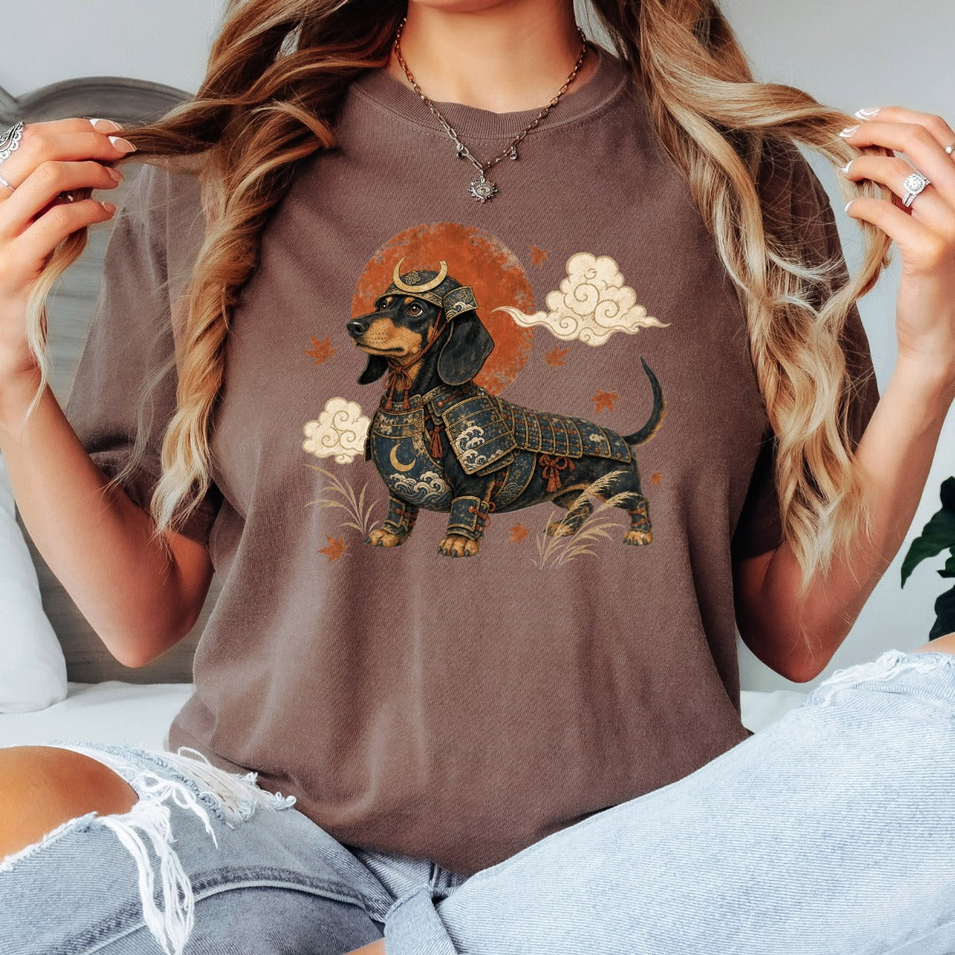 Dachshund in samurai armor with sun and clouds graphic on a brown t-shirt.