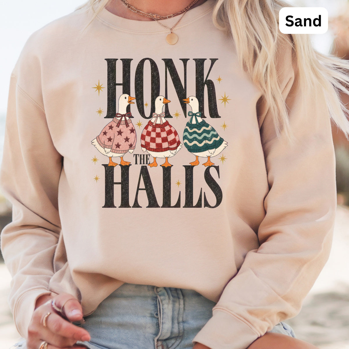 Sand sweatshirt with "Honk the Halls" text and three ducks in festive sweaters.