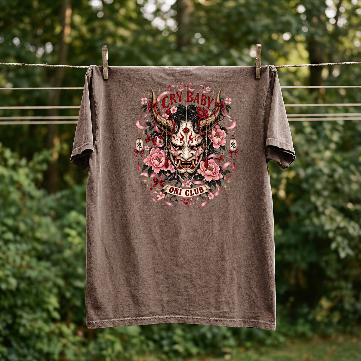 Brown t-shirt with a "Cry Baby Oni Club" graphic featuring a Japanese demon mask and flowers.