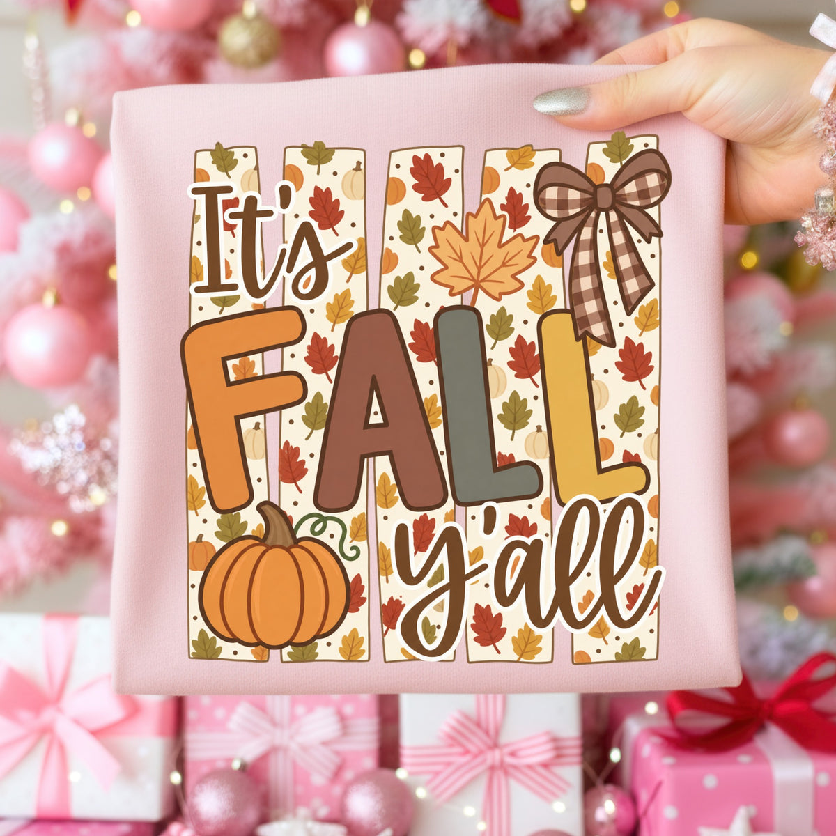 It's FALL y'all text with pumpkin, leaves, and plaid bow on pink fabric.