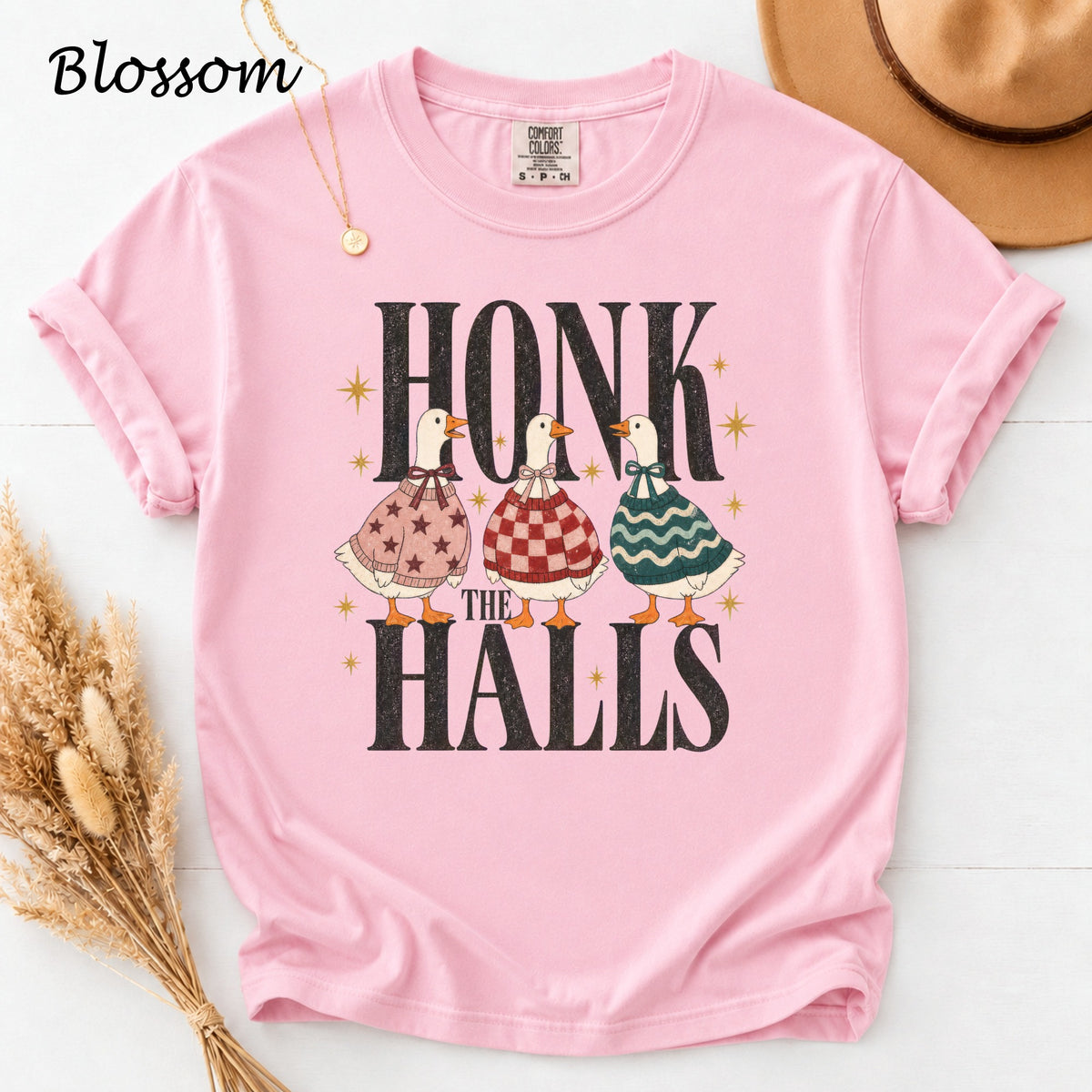Pink t-shirt with "HONK THE HALLS" text and three ducks.