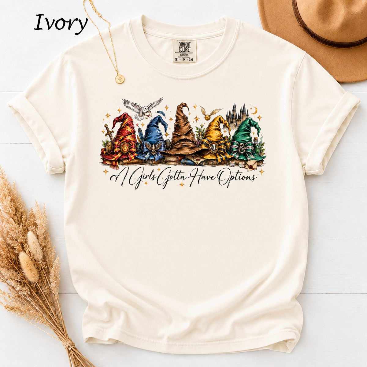 Ivory t-shirt with wizard hats and text "A Girls Gotta Have Options".