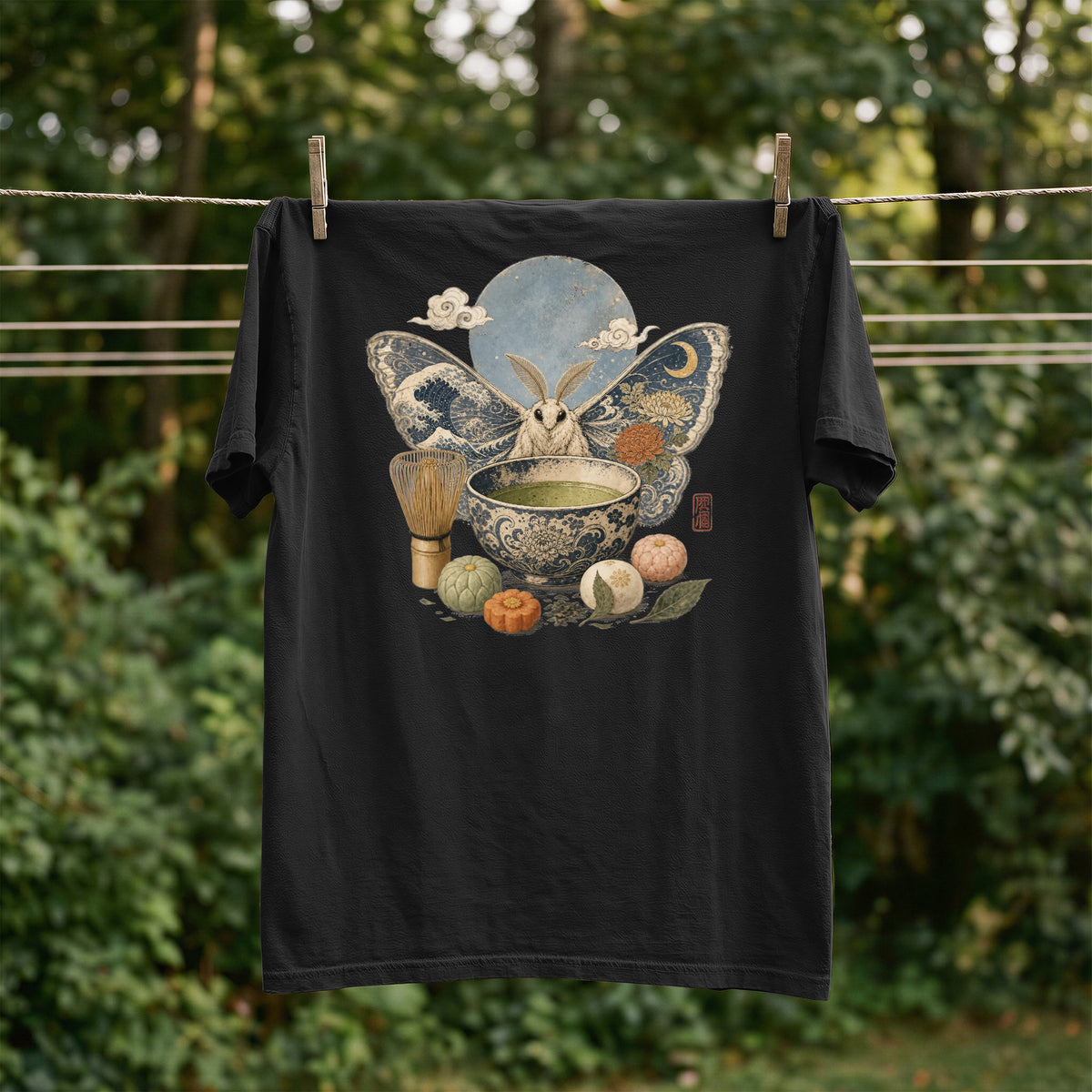 Black t-shirt with Japanese-inspired moth, matcha tea set, and moon design.