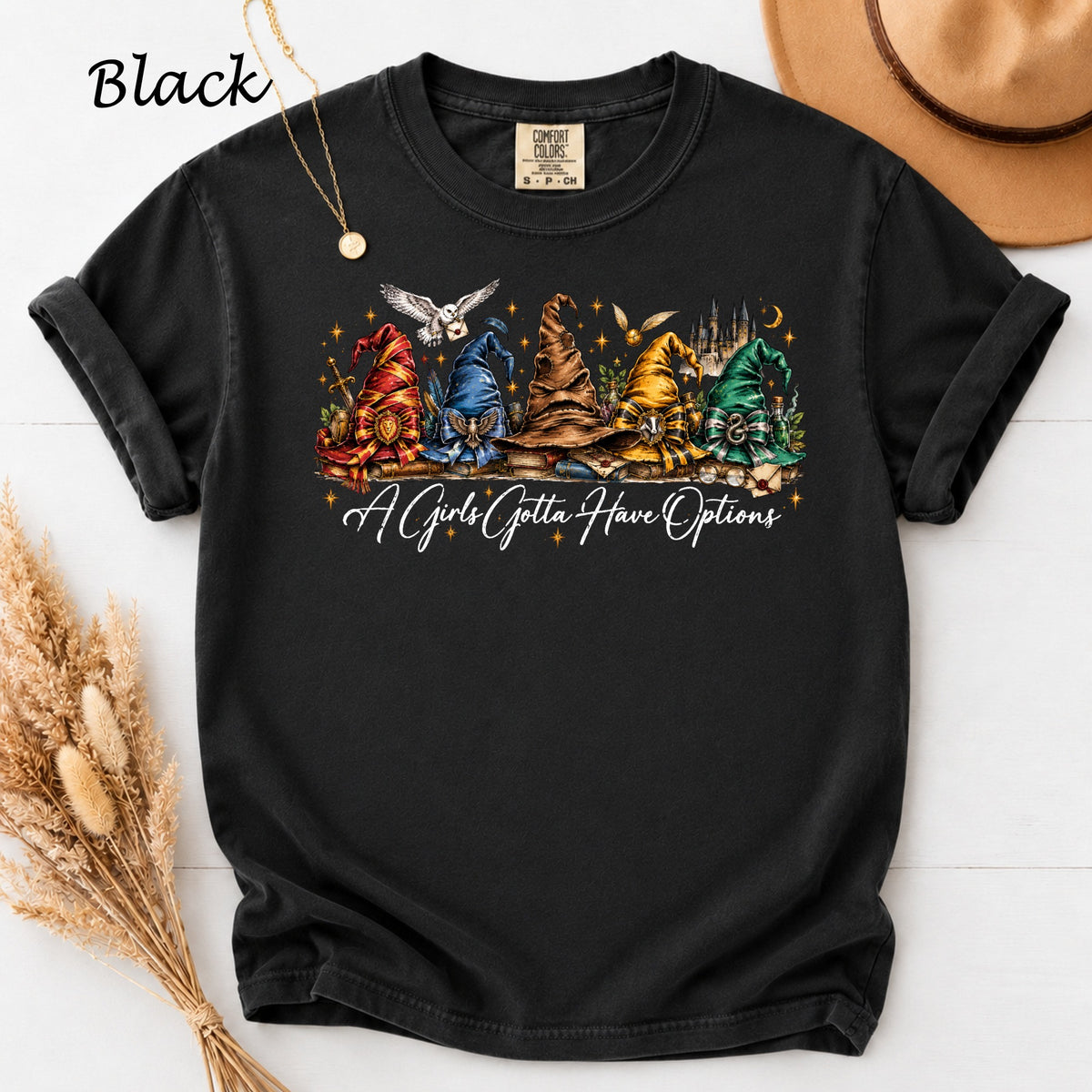 Black t-shirt with five wizard hats and text "A Girls Gotta Have Options".