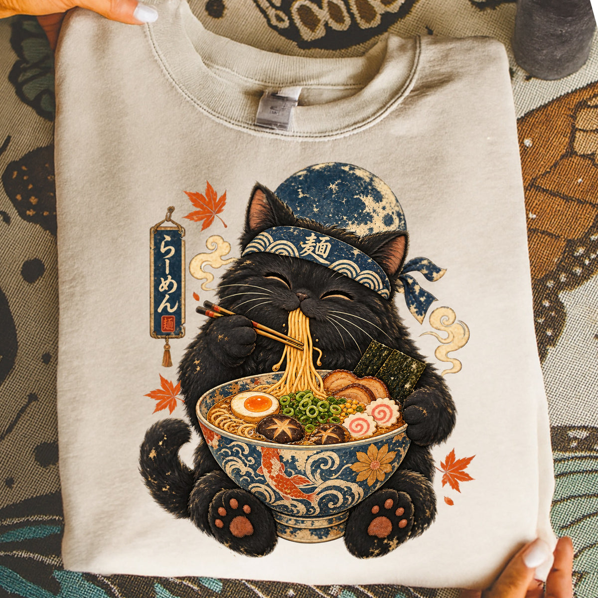 Black cat with bandana eating ramen from a decorative bowl.