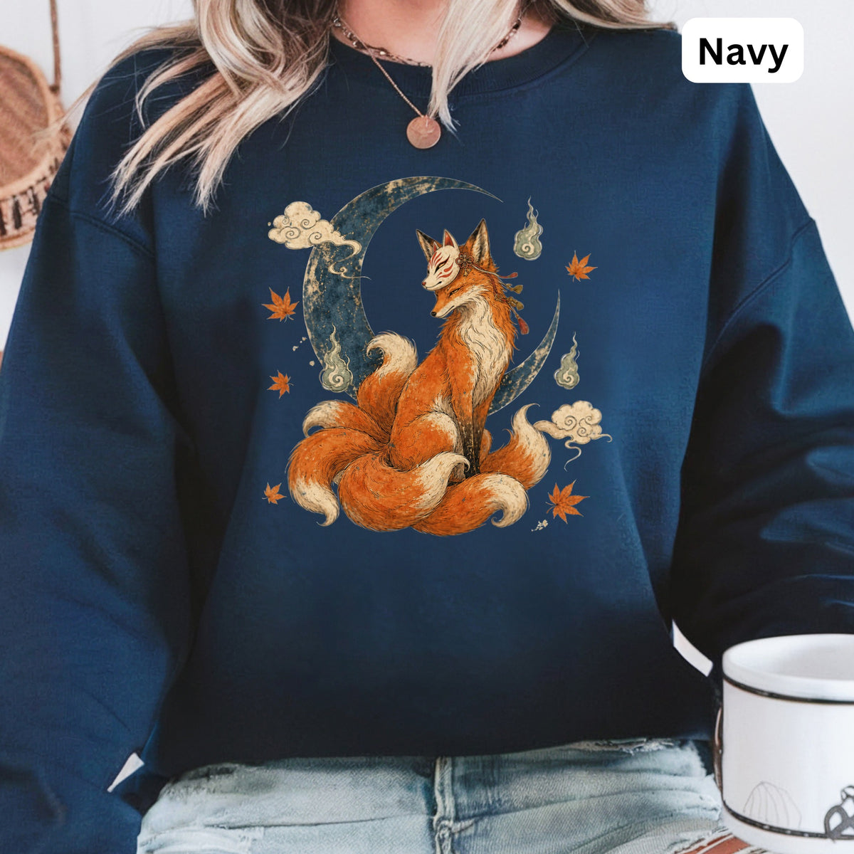 Navy sweatshirt with a nine-tailed fox, mask, moon, clouds, and leaves design.