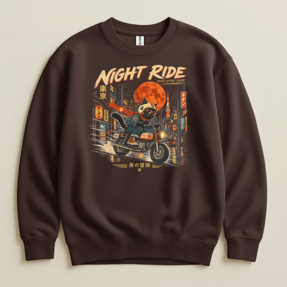 Brown sweatshirt with graphic of cat riding motorcycle in neon Tokyo at night.