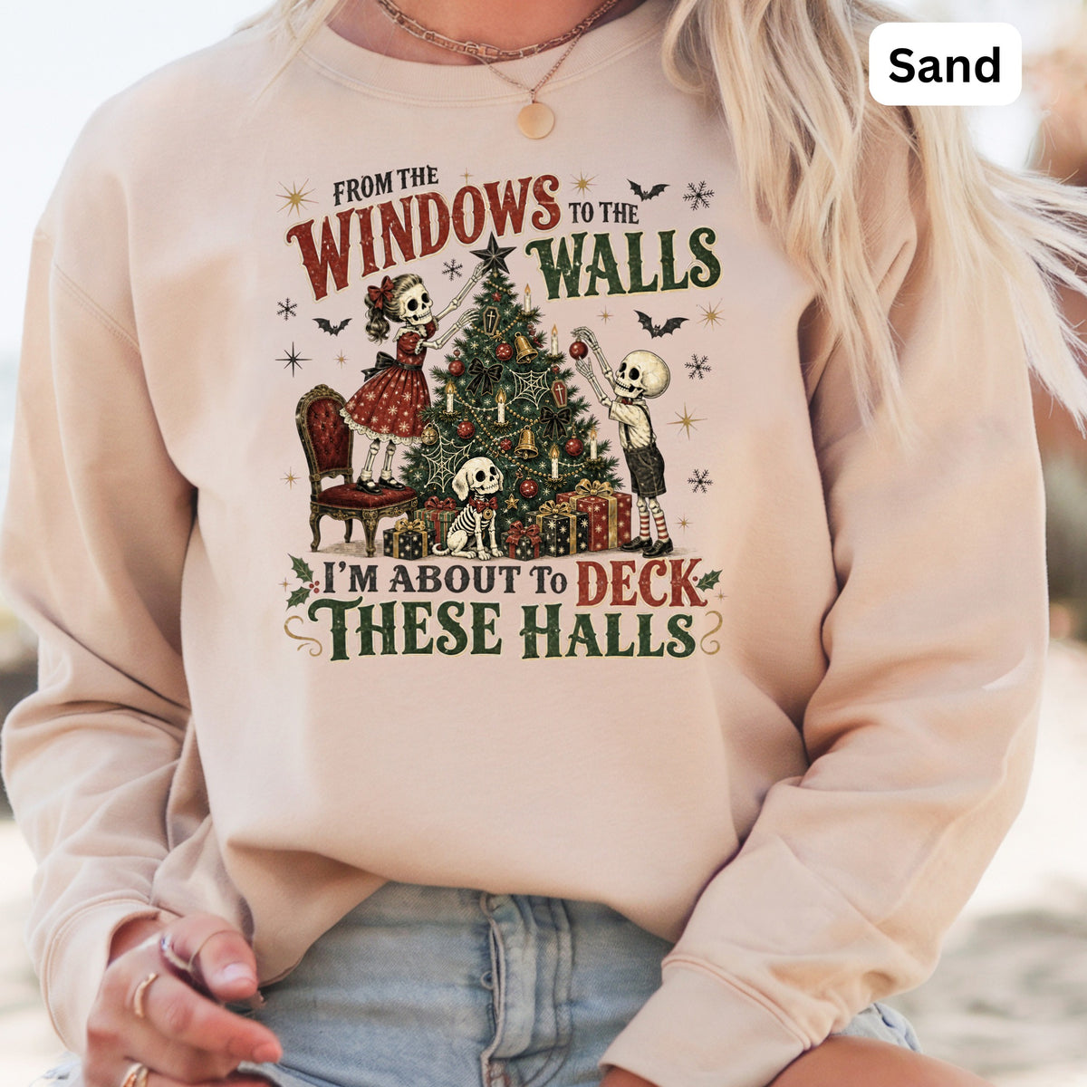 Skeleton figures decorate a Christmas tree with the text "I'm About To Deck These Halls."